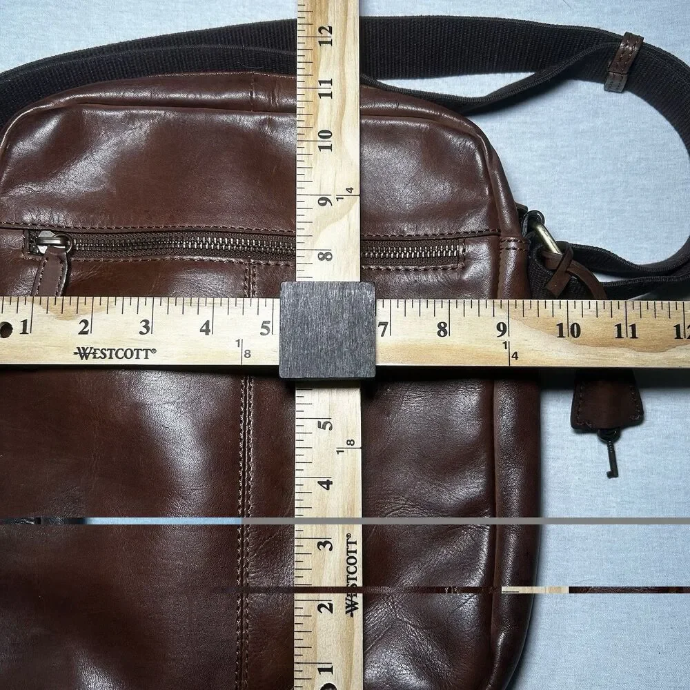 brown genuine leather crossbody bag features a lockable front flap closure